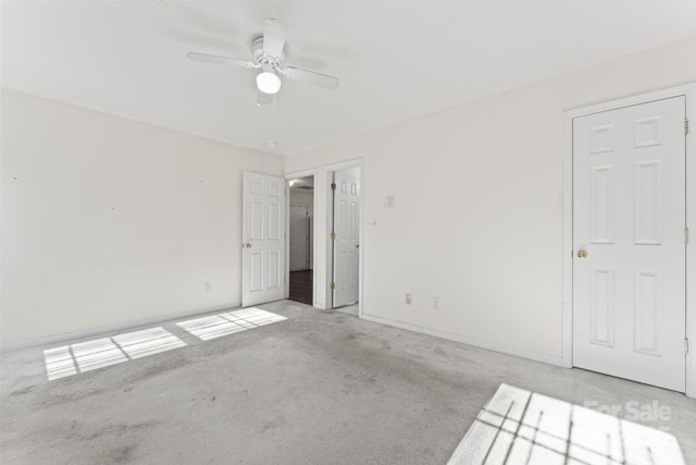 unfurnished bedroom with carpet floors, ceiling fan, and baseboards