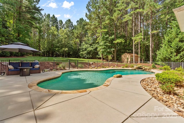 view of pool featuring fence, an outdoor hangout area, a fenced in pool, and a patio