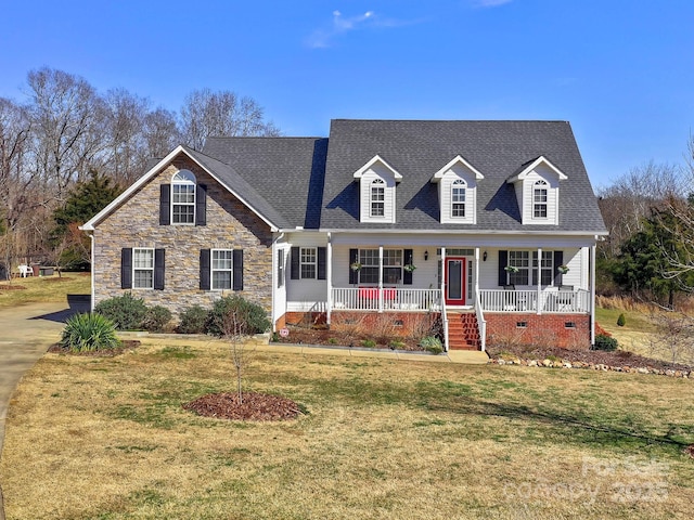 cape cod house with a porch, crawl space, a shingled roof, and a front lawn