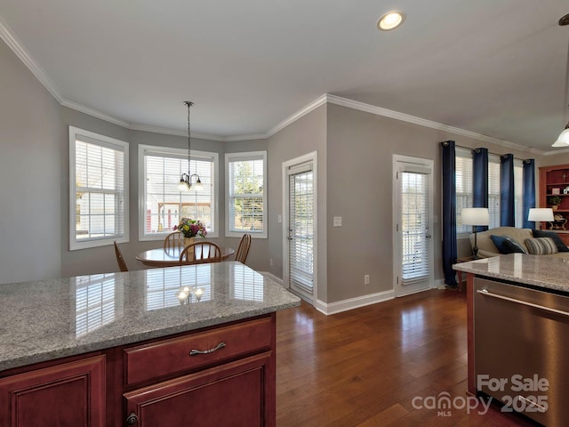 kitchen with a notable chandelier, crown molding, dark wood finished floors, and dishwasher