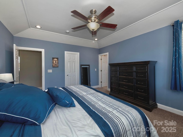 carpeted bedroom with baseboards, a raised ceiling, a ceiling fan, and recessed lighting