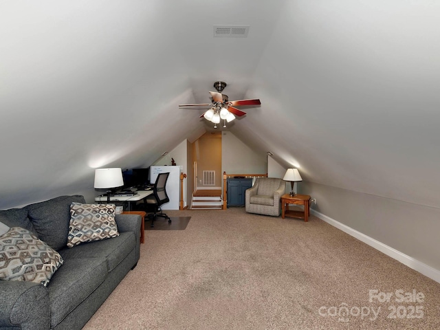 interior space featuring ceiling fan, baseboards, visible vents, and vaulted ceiling