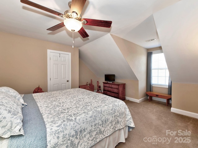 bedroom featuring light carpet, a ceiling fan, visible vents, vaulted ceiling, and baseboards