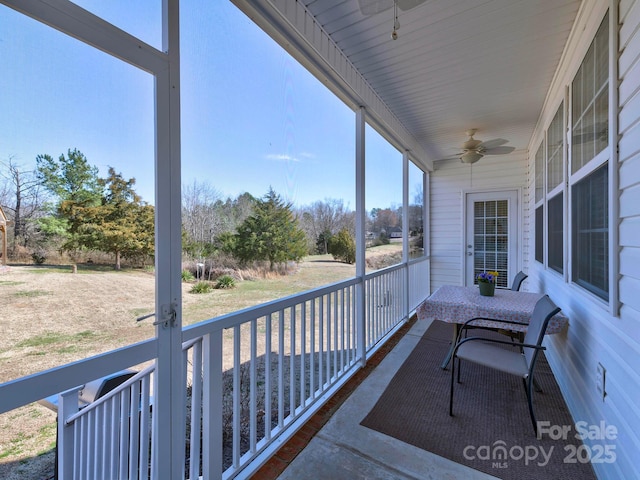 balcony featuring covered porch and ceiling fan