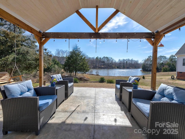 view of patio / terrace with a water view, a gazebo, and an outdoor hangout area