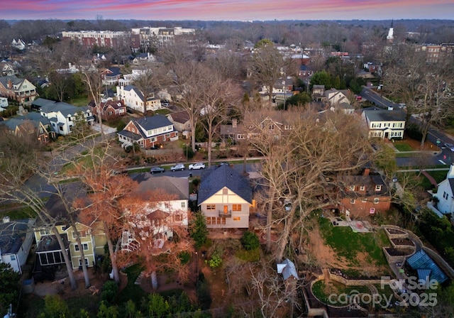 aerial view at dusk with a residential view