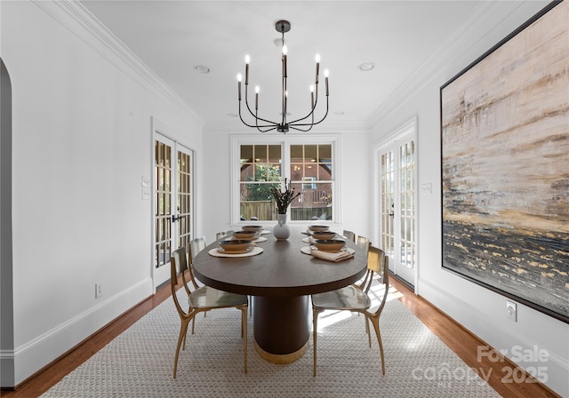 dining room featuring ornamental molding, a wealth of natural light, and french doors