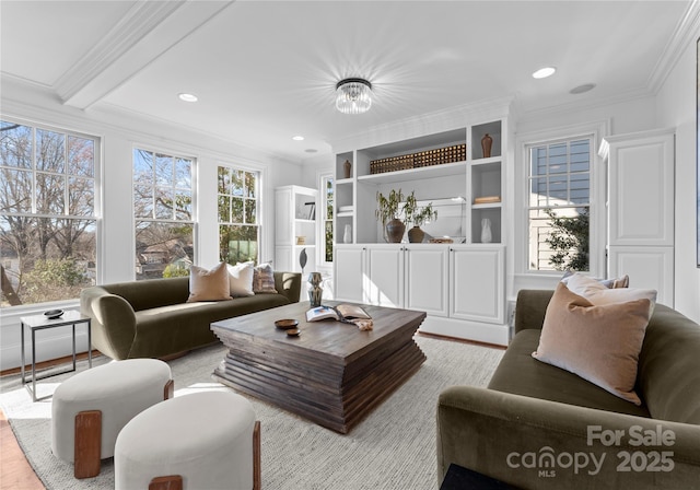 living area with ornamental molding, plenty of natural light, wood finished floors, and recessed lighting