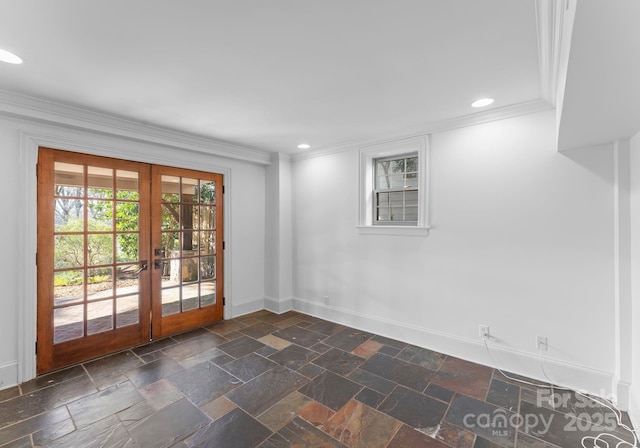 empty room with french doors, recessed lighting, stone tile flooring, ornamental molding, and baseboards