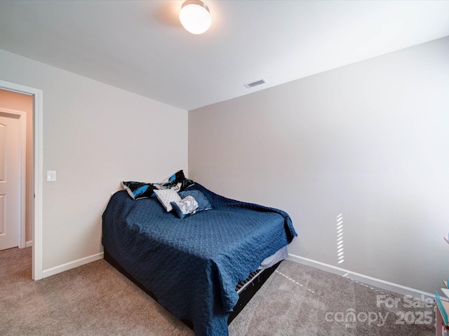 bedroom featuring carpet floors, baseboards, and visible vents