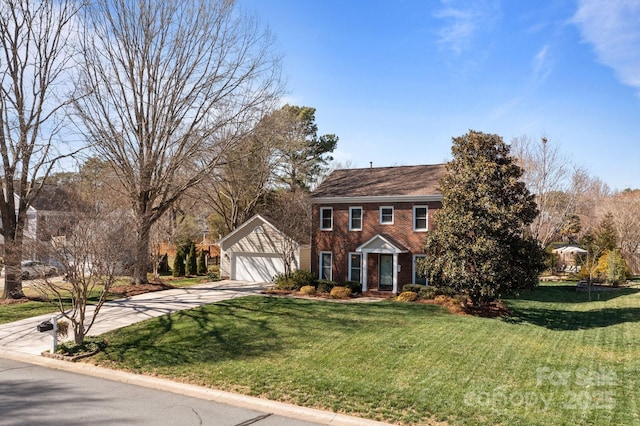 colonial home featuring a garage, concrete driveway, a front lawn, and brick siding