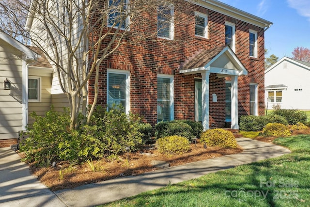 view of front of property featuring brick siding