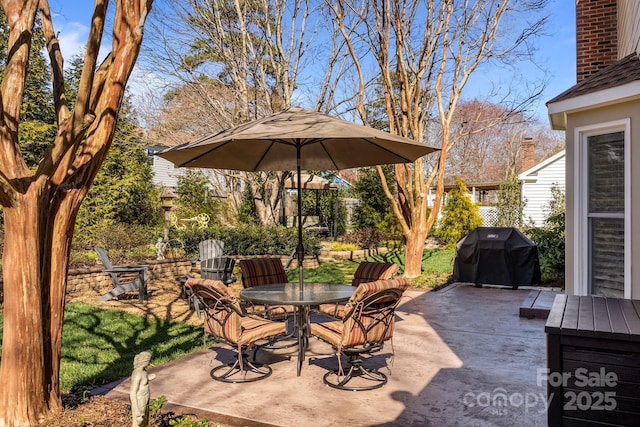 view of patio featuring grilling area and outdoor dining space