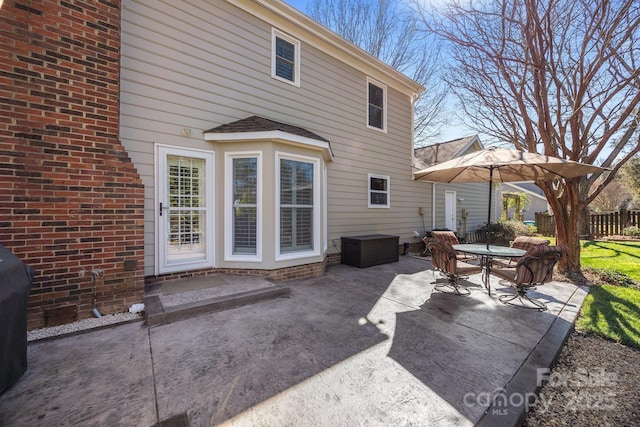 view of patio / terrace featuring fence