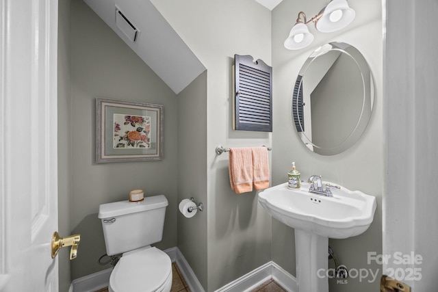 bathroom featuring toilet, baseboards, and visible vents