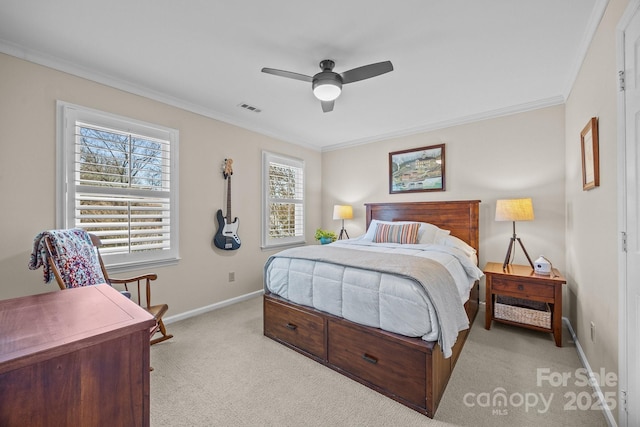 bedroom featuring light colored carpet, visible vents, ornamental molding, a ceiling fan, and baseboards