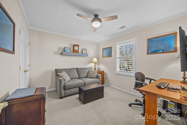 office area with carpet floors, a ceiling fan, baseboards, visible vents, and crown molding