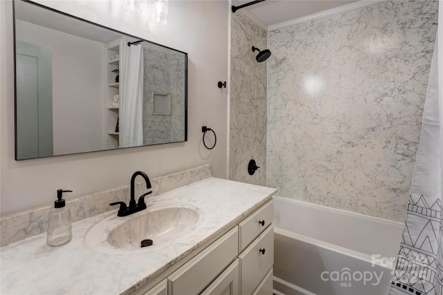 full bathroom featuring ornamental molding, vanity, and washtub / shower combination