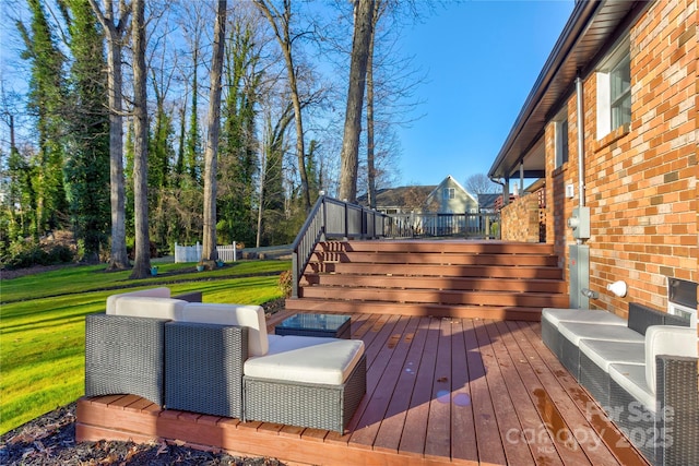 wooden terrace featuring a yard