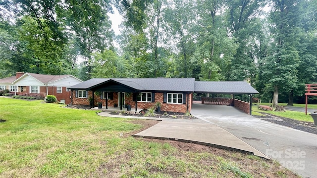 308 Dakota St, Kannapolis, NC 28083 - single story home featuring a front lawn, an attached carport, brick siding, and driveway