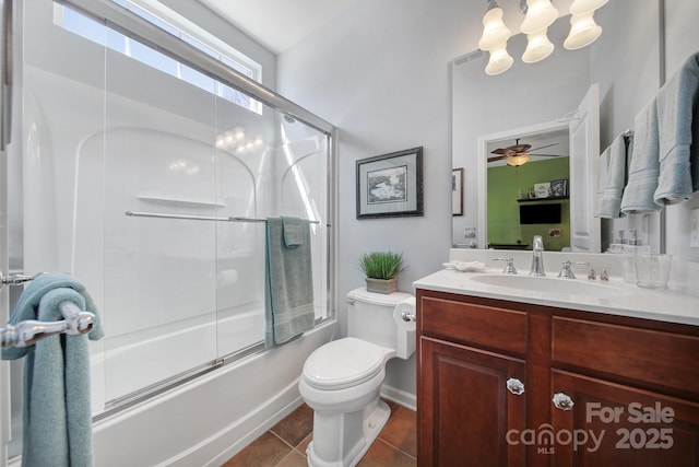 bathroom with visible vents, bath / shower combo with glass door, toilet, tile patterned floors, and vanity