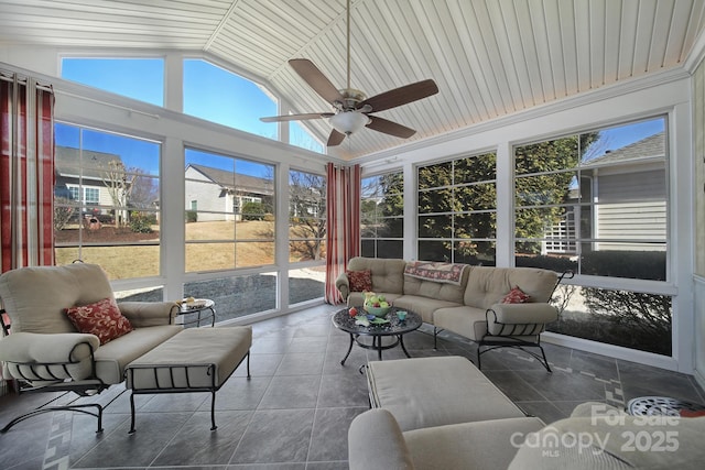 sunroom featuring vaulted ceiling and ceiling fan