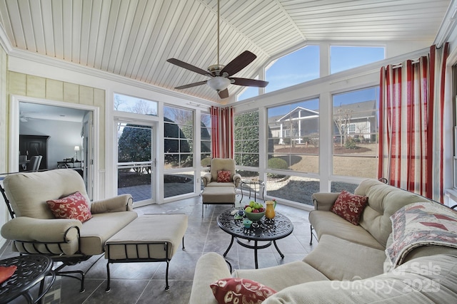 sunroom featuring a ceiling fan and lofted ceiling