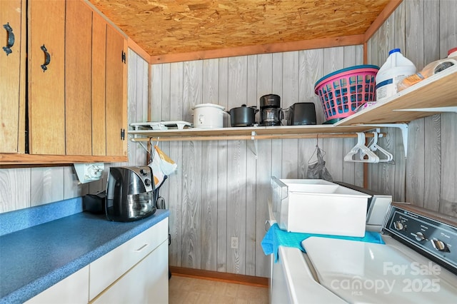 193 Oak Ridge Rd, Hendersonville, NC 28792 - laundry room with wood ceiling, wooden walls, cabinet space, and washer and dryer