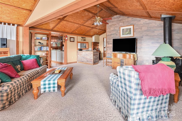 193 Oak Ridge Rd, Hendersonville, NC 28792 - living room featuring built in shelves, carpet floors, lofted ceiling with beams, a ceiling fan, and a wood stove
