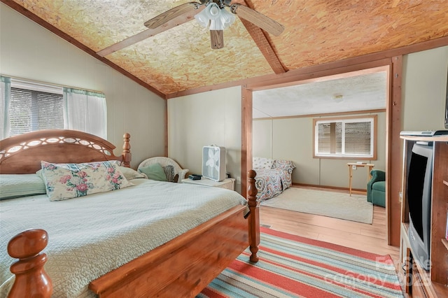193 Oak Ridge Rd, Hendersonville, NC 28792 - bedroom with crown molding, a ceiling fan, vaulted ceiling, and wood finished floors