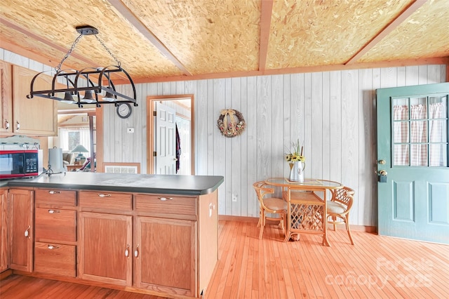 193 Oak Ridge Rd, Hendersonville, NC 28792 - kitchen featuring a peninsula, dark countertops, and light wood-style flooring