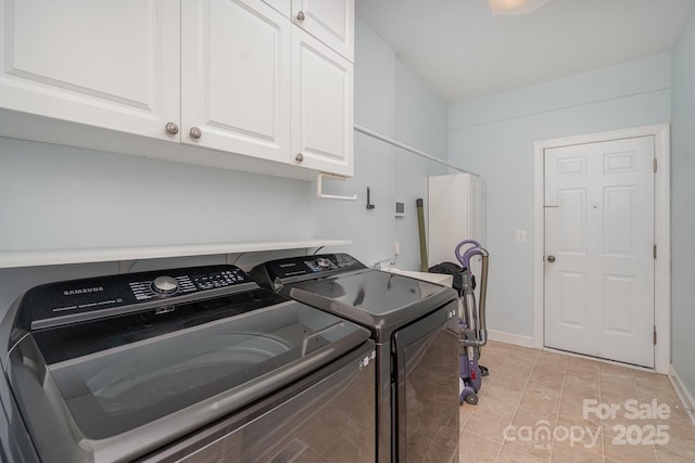 washroom featuring cabinet space, independent washer and dryer, baseboards, and light tile patterned floors