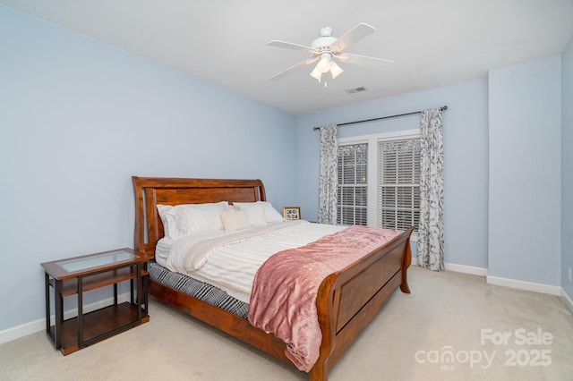 bedroom with visible vents, baseboards, a ceiling fan, and light colored carpet