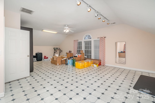 additional living space with lofted ceiling, light floors, visible vents, and baseboards