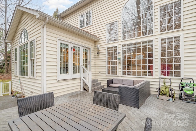 wooden terrace featuring entry steps, an outdoor hangout area, and outdoor dining space