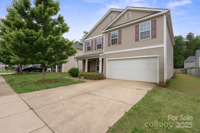 traditional-style home featuring an attached garage and driveway