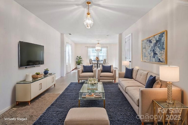 living area with light wood-style floors and baseboards