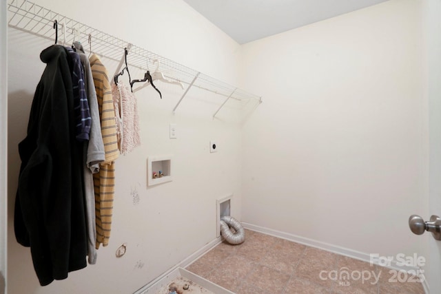 laundry area featuring electric dryer hookup, washer hookup, baseboards, hookup for a gas dryer, and tile patterned flooring