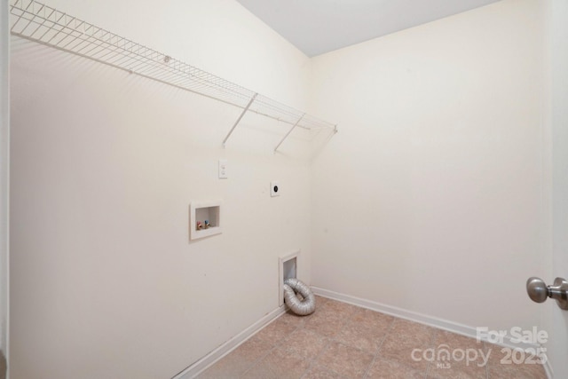 laundry room featuring electric dryer hookup, hookup for a washing machine, and baseboards