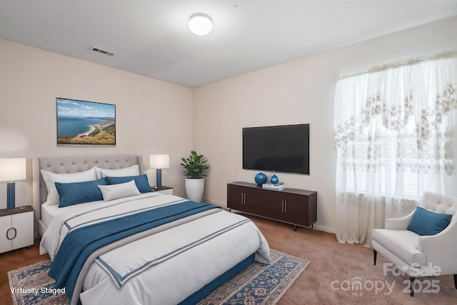 bedroom with carpet flooring and baseboards
