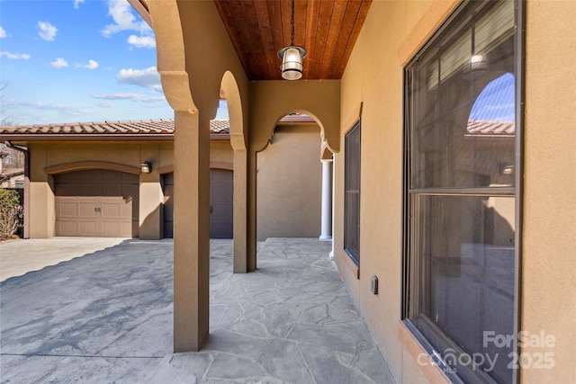 view of patio featuring a garage