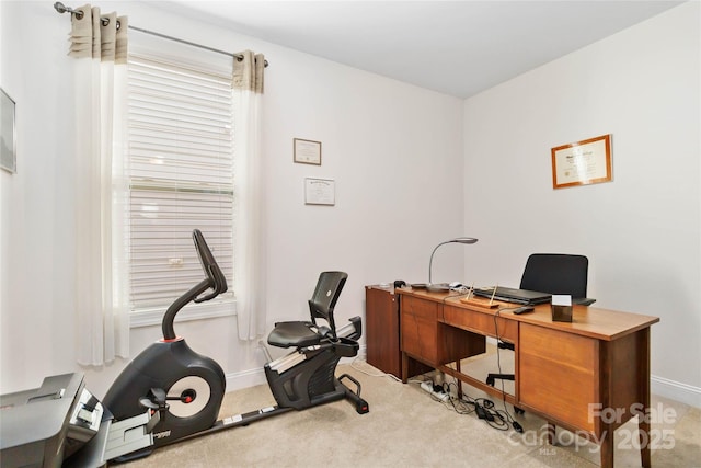 home office with carpet and baseboards