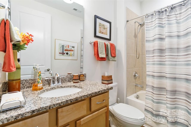 full bath featuring toilet, visible vents, vanity, and shower / tub combo with curtain