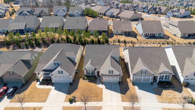 birds eye view of property with a residential view