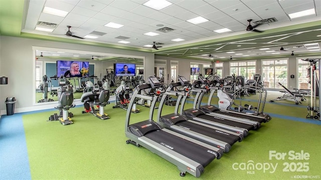 gym featuring visible vents and a ceiling fan