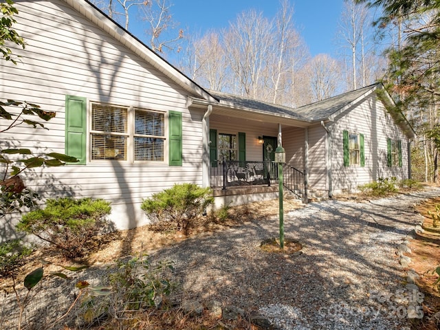 view of property exterior featuring a porch