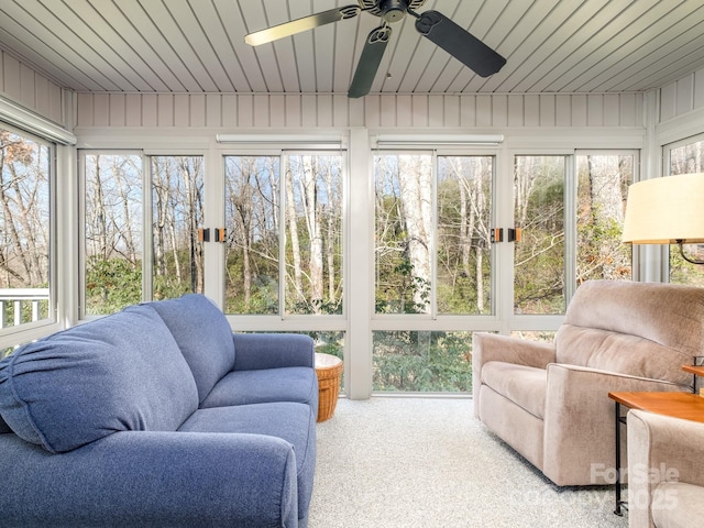 sunroom with wooden ceiling and ceiling fan