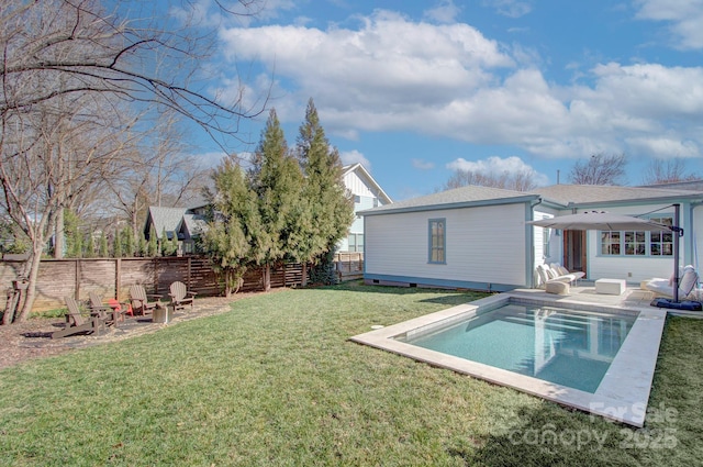 exterior space featuring a yard, a patio, fence, and a fenced in pool