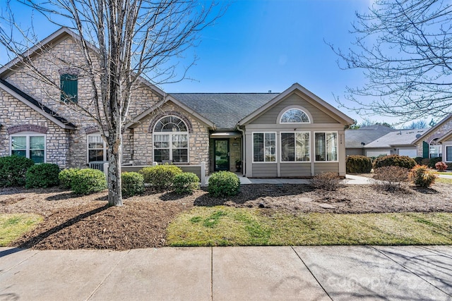 view of front of property with a shingled roof