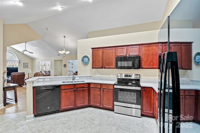 kitchen with ceiling fan with notable chandelier, a peninsula, open floor plan, light countertops, and black appliances